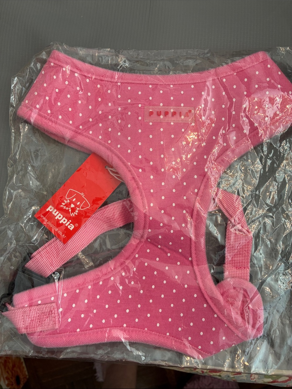 Pink polka-dot harness-like garment